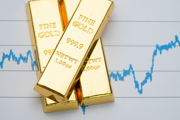 Gold bar, bullion stack on rising price graph as financial crisis or war safe haven, financial asset, investment and wealth concept