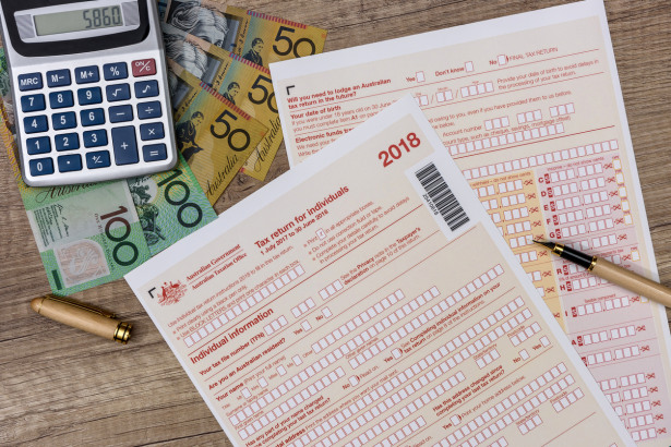 Australian dollars with calculator and tax form