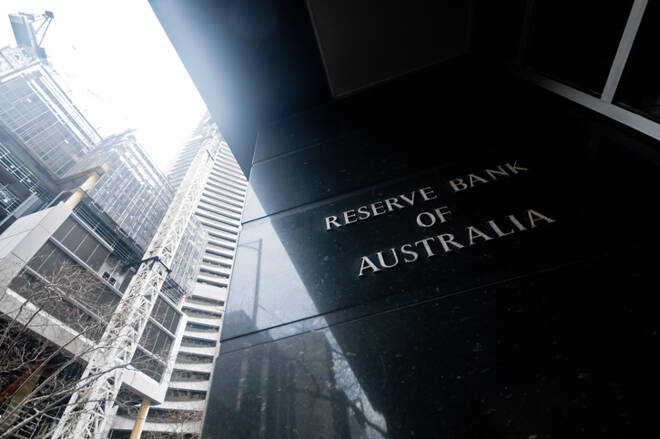 Reserve Bank of Australia name on black granite wall in Melbourne Australia with a reflection of high-rise buildings