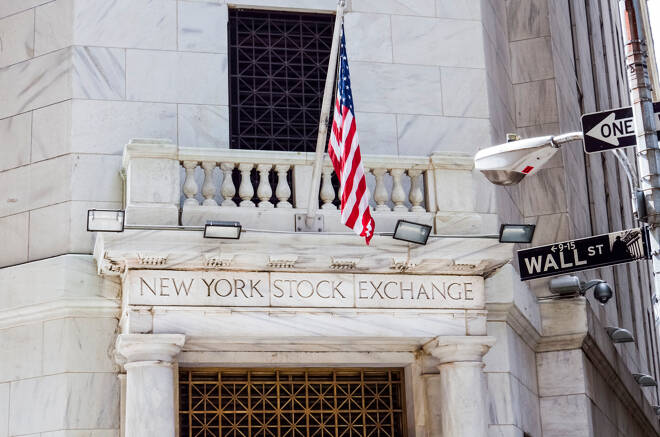 New York Stock Exchange with American flags and Wall street
