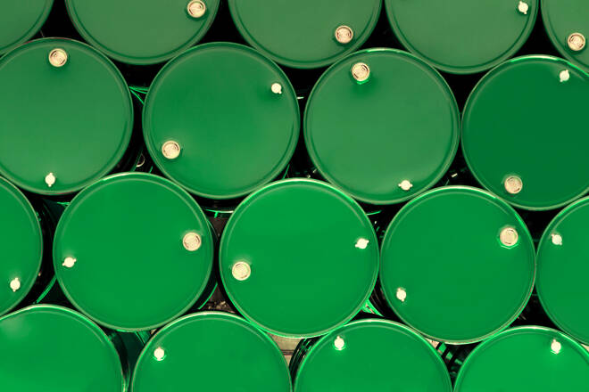 green steel chemical tanks or oil tanks stacked in row.