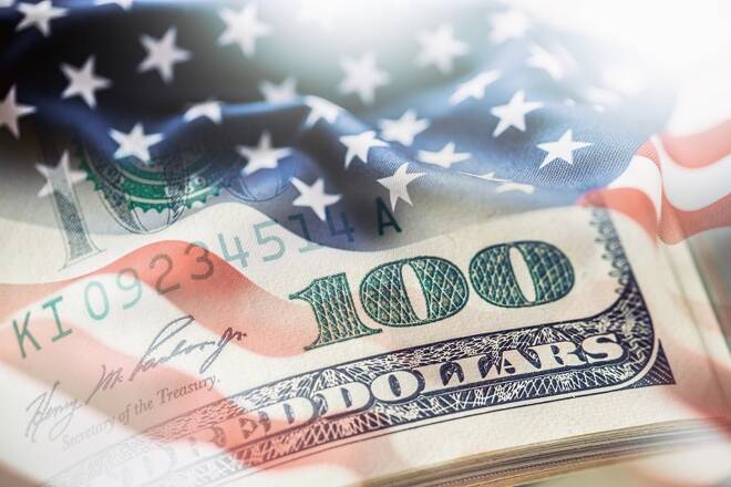 USA flag and American dollars. American flag blowing in the wind and 100 dollars banknotes in the background