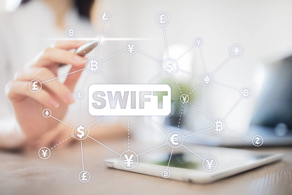 SWIFT, Society for Worldwide Interbank Financial Telecommunications, online payment and financial regulation concept.
