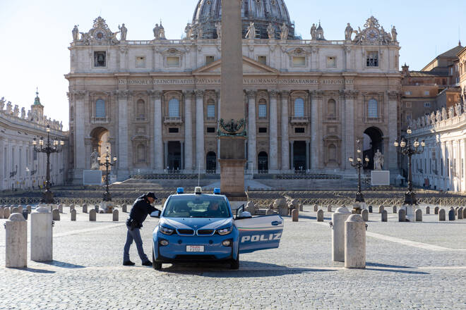 Coronavirus emergency in Rome, a police car presides over the deserted Piazza San Pietro.