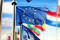 EU flags waving over blue sky. Brussels, Belgium