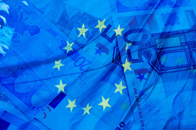 blue background with euro bills and european union flag symbolizing euro zone
