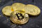 Golden bitcoins on the black background closeup. Cryptocurrency virtual money