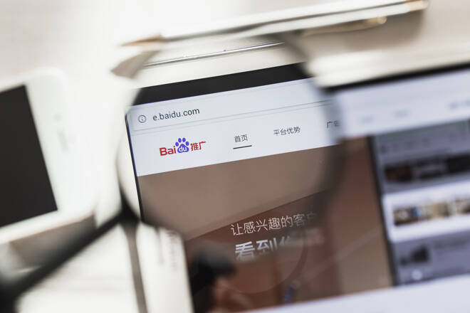 China, Beijing - 7 March 2019: Baidu, Search system official website homepage under magnifying glass. Concept Baidu, Search system logo visible on tablet screen, smartphone