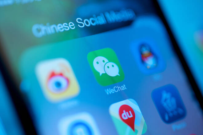 Shanghai, China - December 30, 2013: Emergence of Chinese Social Media and the rise of WeChat from Tencent in competing with Facebook.