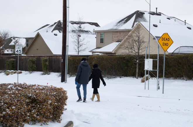 Mckinney, TX USA - February 17, 2021: Street view of Texan walking on the road after snowstorm — Stock Image