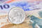 New Zealand dollar money banknote close-up with coins