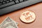 Nft (non fungible token) concept: big copper coin on a wooden ta