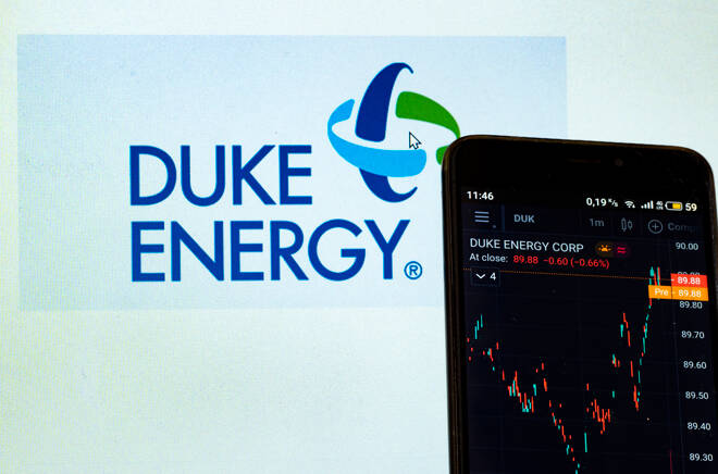In this photo illustration the stock market information of Duke