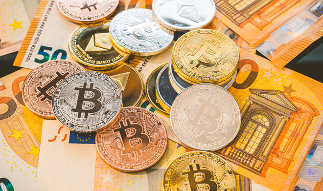 Bitcoin BTC coins on bills of euro banknotes. Worldwide virtual