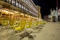Night view of one Bar on the Piazza San Marco showing a multitude of empty chairs and empty square