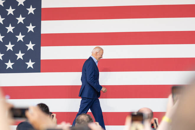 ARLINGTON VA, UNITED STATES - Jul 24, 2021: Joe Biden walking on stage at a campaign rally for Terry McAuliffe in Arlington Virginia.