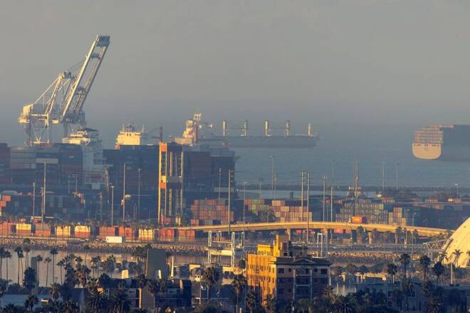 The port of Long Beach is shown as a record number of cargo container ships wait to unload