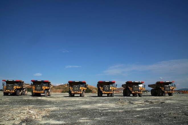 Dumper trucks sit in a line at the Kibali gold mine Haut-Uele province