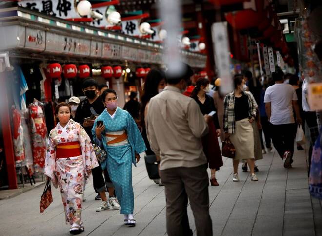 Kimono-clad tourists wearing protective face masks walk along Nakamise Street at Asakusa district, a popular sightseeing spot, amid the coronavirus disease (COVID-19) outbreak in Tokyo