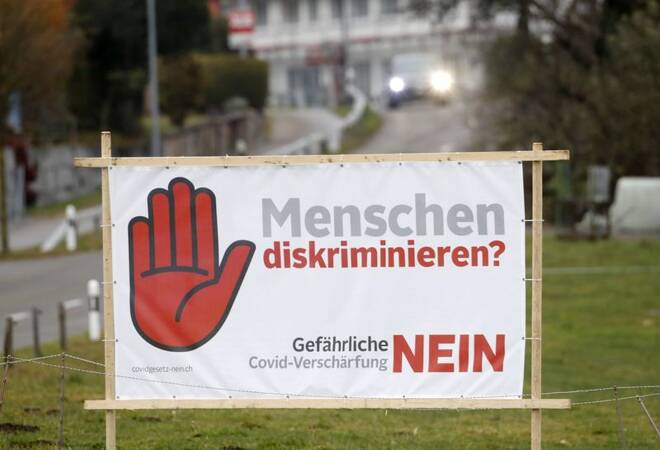 Poster is seen before Swiss voters decide about the federal government's pandemic response plan, near Oberwil-Lieli