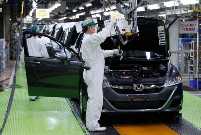 Workers assemble cars at Honda Motor's Saitama factory in Sayama