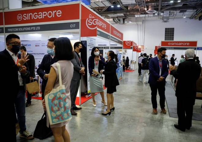 Visitors attend the Restaurants Asia and Cafe Asia trade conventions in Singapore
