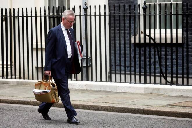 Britain's Housing Secretary Michael Gove walks in Downing Street in London