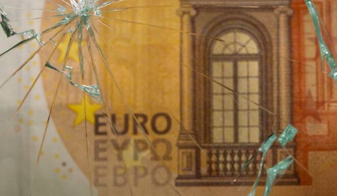 Euro banknote is seen through broken glass in this illustration