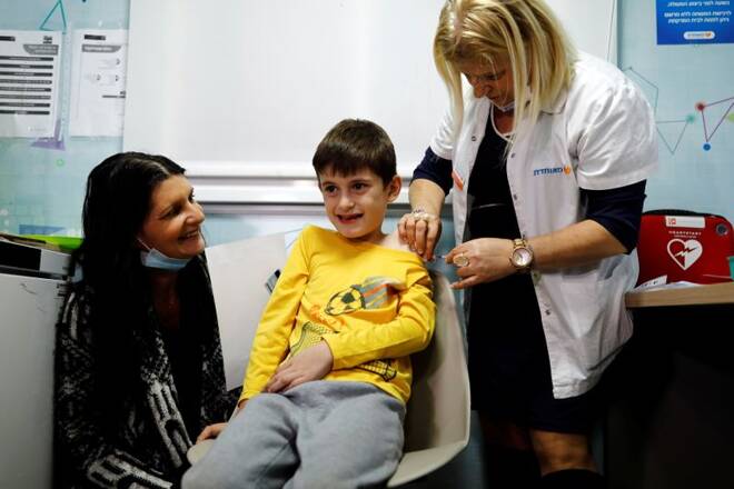 Yoav receives his first coronavirus disease COVID-19 vaccination, after the country approved vaccinations for children aged 5-11, in Tel Aviv