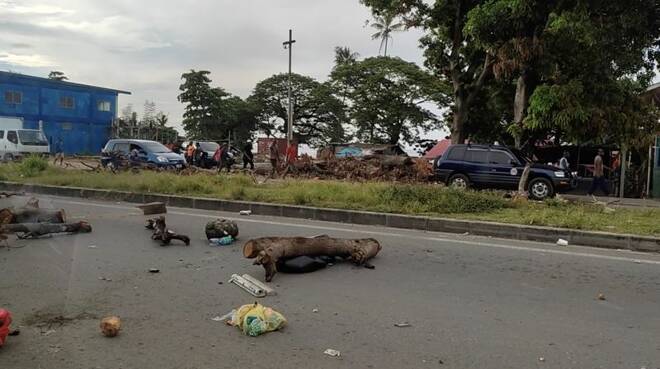 Debris is seen on a highway, after protests against the government in Honiara
