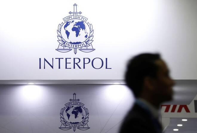 A man passes Interpol signages at Interpol World in Singapore