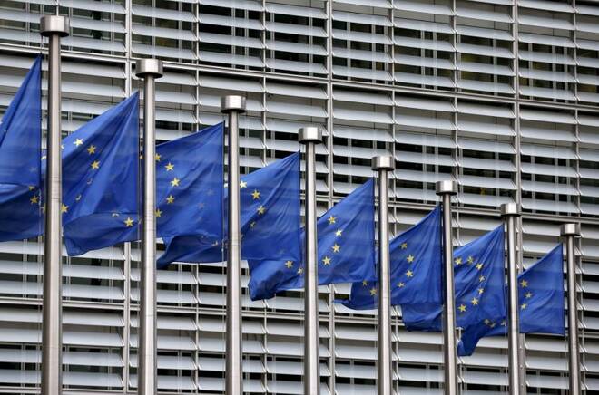 Picture shows European Union flags fluttering outside the EU Commission headquarters in Brussels
