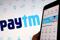 The interface of Indian payments app Paytm is seen in front of its logo displayed in this illustration picture