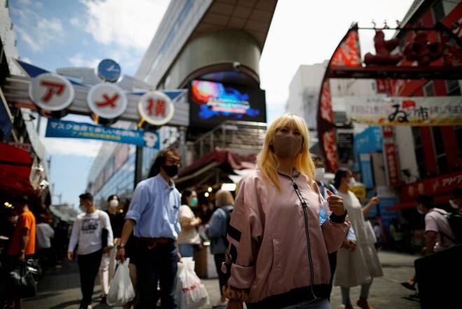 Shoppers walk at the Ameyoko shopping district, where Tokyo’s biggest street food market is located, in Tokyo