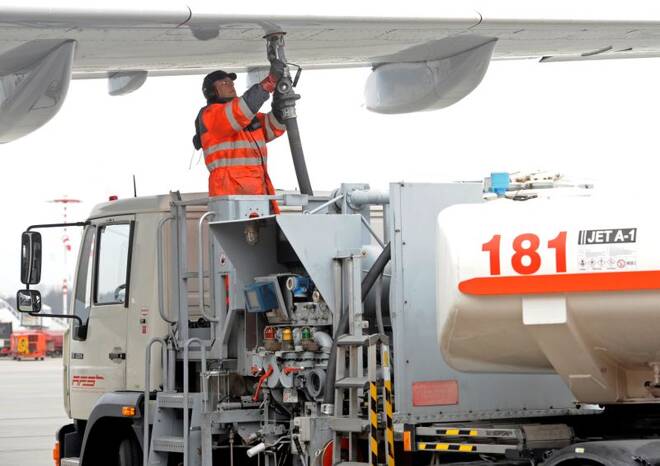 A worker fills an Airbus jet with aviation fuel at Fuhlsbuettel airport in Hamburg