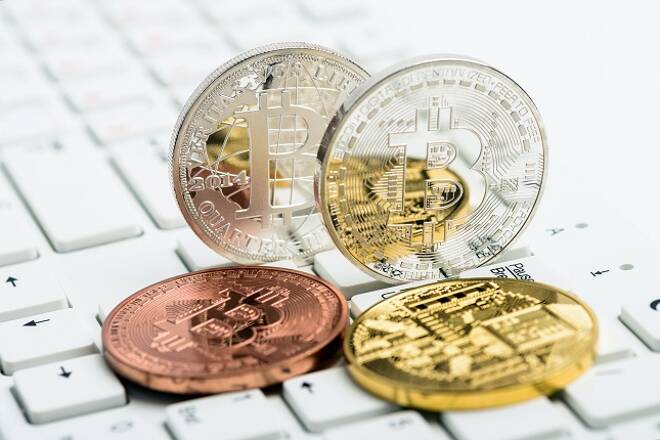 Bitcoin coins on white keyboard