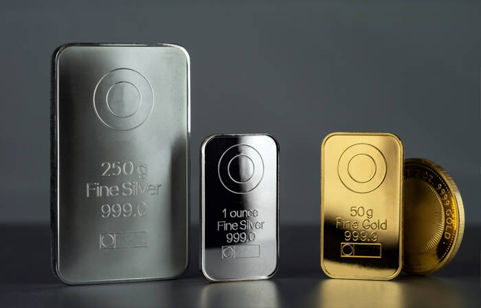 Silver,And,Gold,Bars,And,Coin,On,A,Dark,Background.