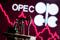 A 3D printed oil pump jack is seen in front of displayed stock graph and Opec logo in this illustration picture