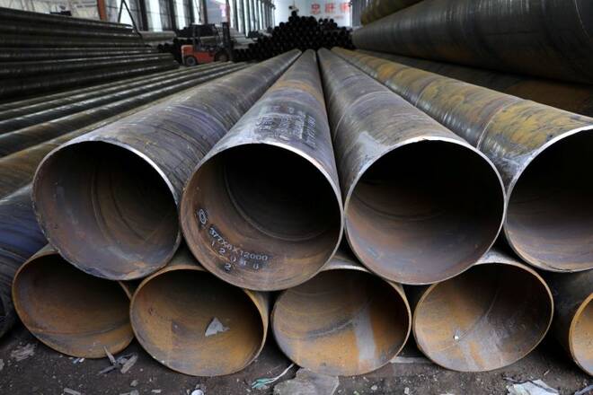 Steel pipes are seen stacked at an industrial park in Shenyang