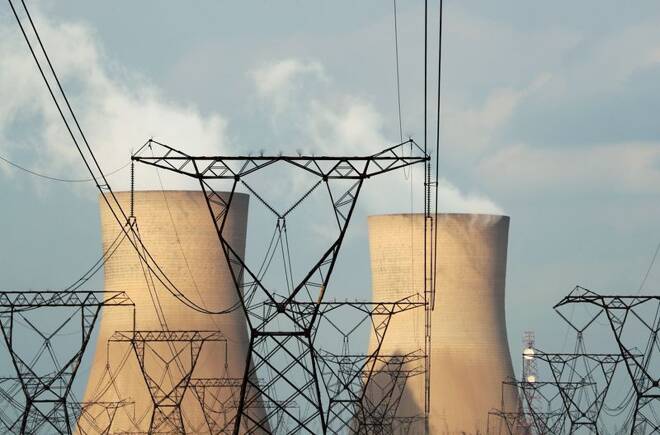 Cooling towers are pictured at a coal-based power station owned by Eskom in Duhva