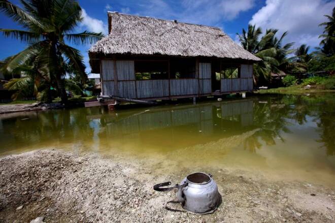 An abandoned house that is affected by sea-water during high-tides stands next to a small lagoon near the village of Tangintebu on South Tarawa in the central Pacific island nation of Kiribati