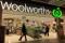 Shoppers walk into a Woolworths supermarket in Sydney