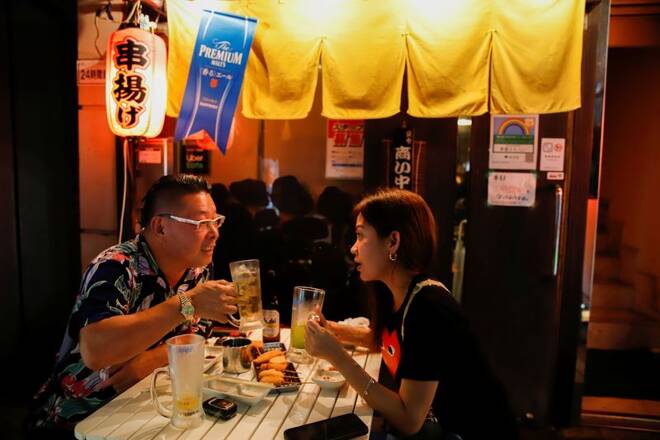 A couple is seen sitting at an outdoor table of a restaurant in Ikebukuro area amid the coronavirus disease (COVID-19) outbreak in Tokyo