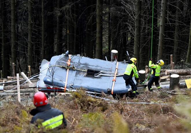 Italian fire brigade removes crashed cable car cabin, in Stresa