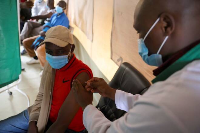 Healthcare professional administers a dose of coronavirus disease (COVID-19) AstraZeneca's vaccine, in Narok