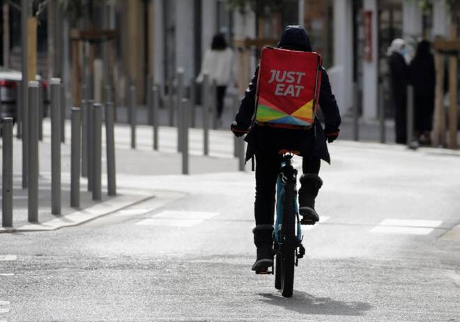 A Just Eat delivery man rides his bicycle in Nice