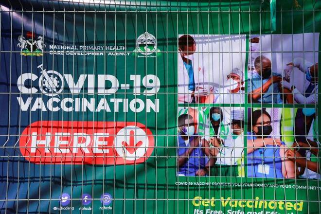 A banner is displayed on a fence at a COVID-19 vaccination centre, after the government commenced the roll out of mass vaccination in Abuja