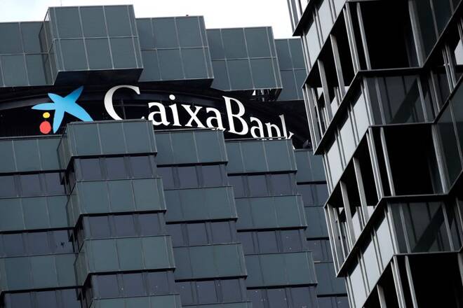 CaixaBank's logo is seen on top of the company's headquarters in Barcelona