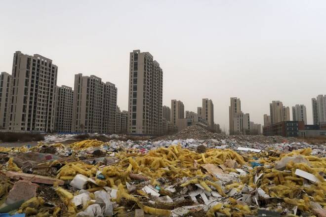 Debris is seen in front of the apartment compound Taoyuan Xindu Kongquecheng developed by China Fortune Land Development, in Zhuozhou