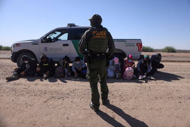 A group of asylum seekers from Mexico, Cuba and Haiti are detained by U.S. Border Patrol in San Luis